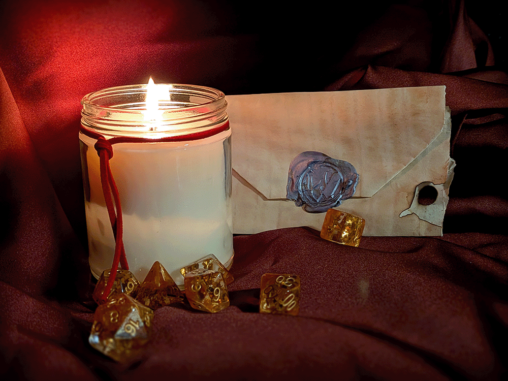 Candle with a wax seal and dice on a red fabric background